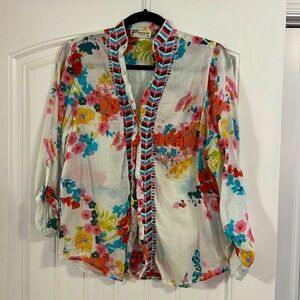 Beautiful floral sheer knit blouse with chevron pattern along buttons